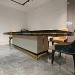 High-Gloss Amber Burl Wood Dining Table with Cream Quilted Leather Base and Metal Inlay